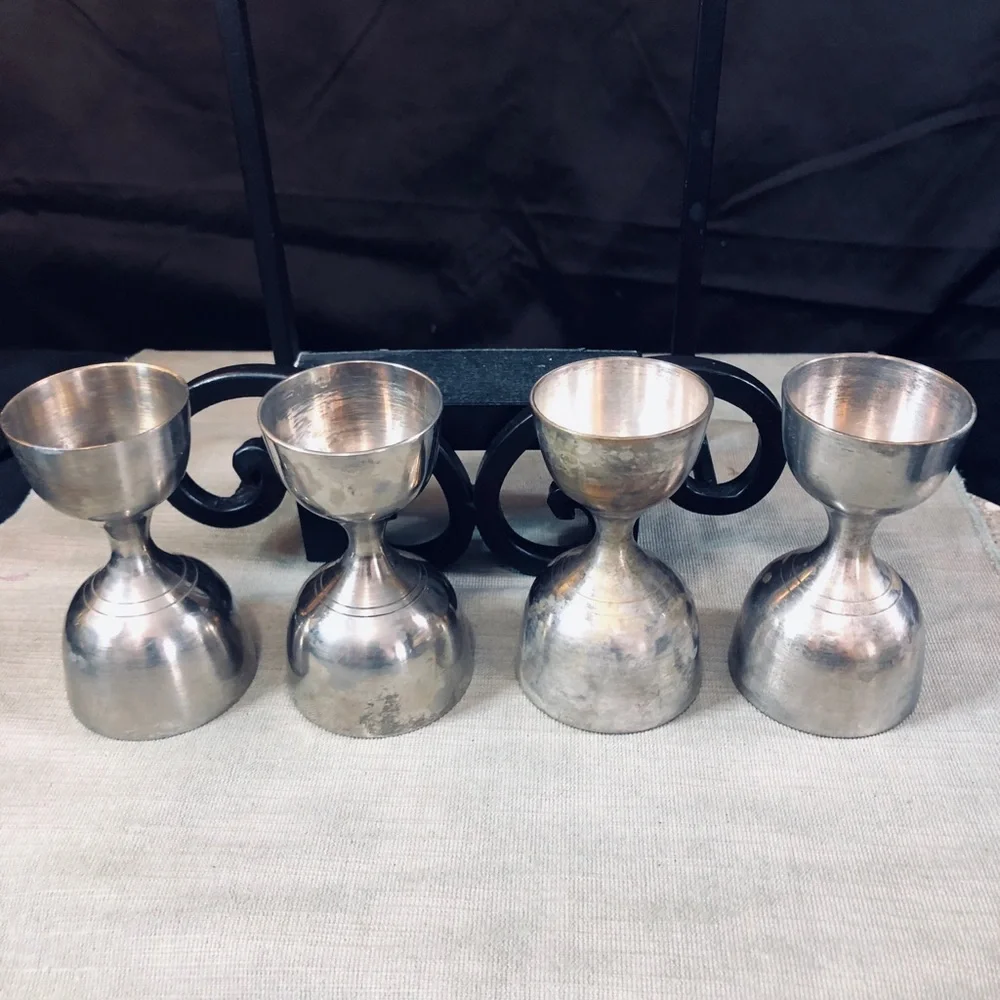 Set of Dansk Jette Stainless Steel flatware and / Four Stainless Steel Pegs